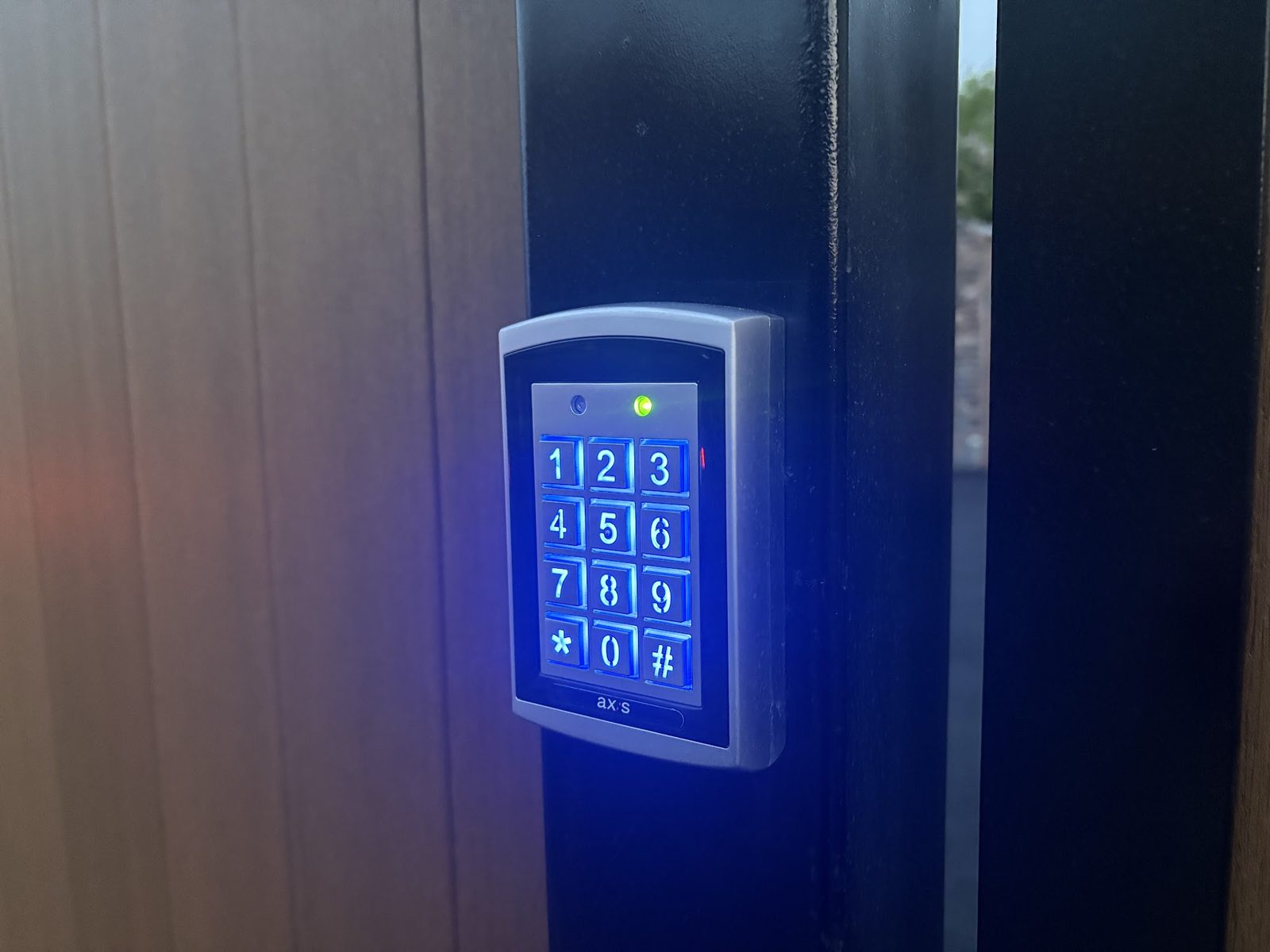 Keypad access control fitted to a gate post